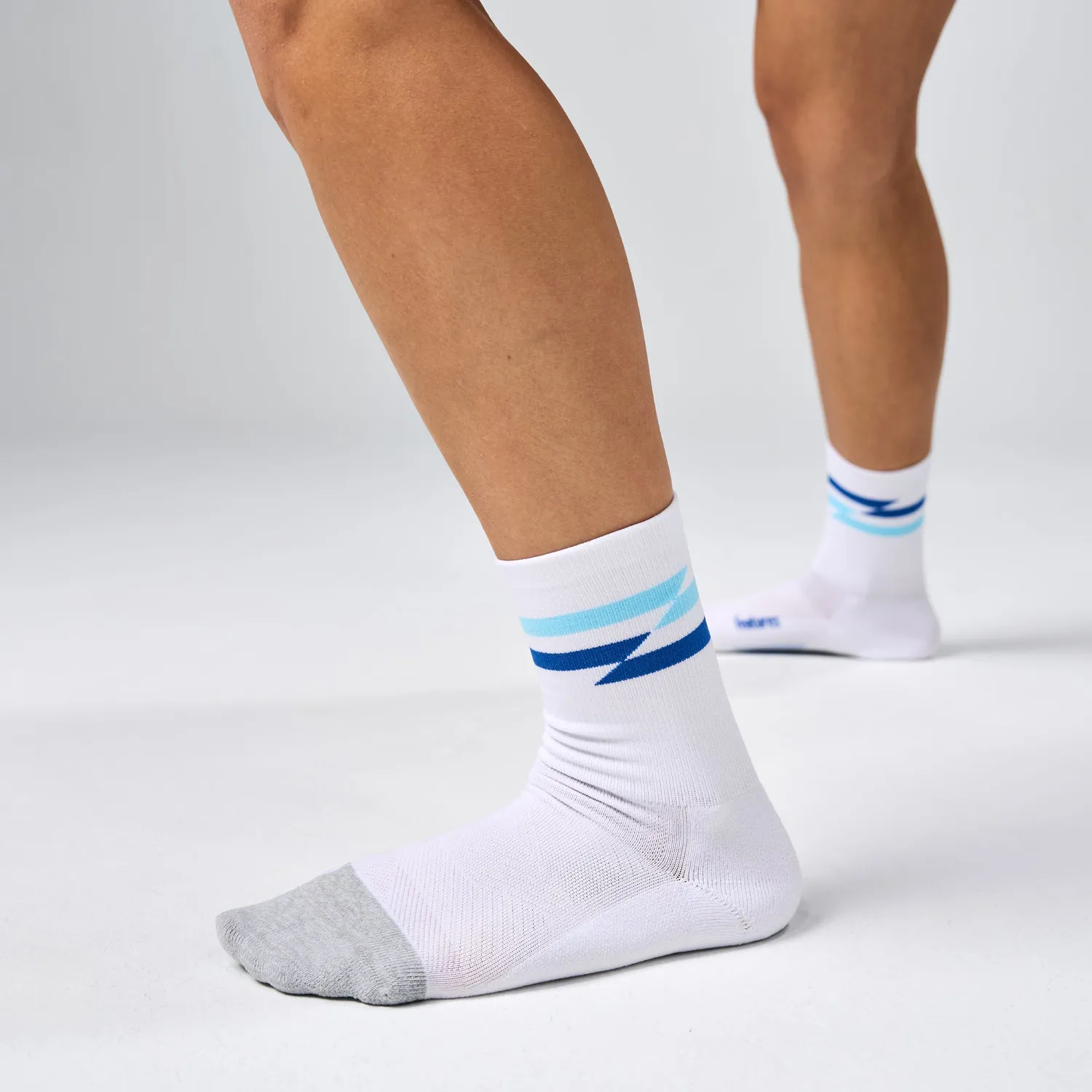 Feetures Elite Light Cushion Mini Crew løbestrømper White Track dæmpning